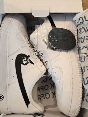 White Low-Top Sneakers with Black Swoosh Accent